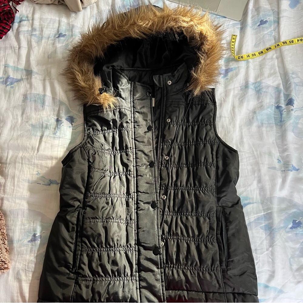 black puffy vest with fur hood